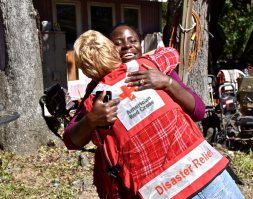 High winds from Hurricane Matthew brought down huge trees all around Shanta Millan’s home on Edisto Island, but her home survived intact. “Yes, we have storm damage, but we know how lucky we really are in life,” said Shanta as she gave Red Cross disaster responder Michelle Hankes big hug. Photo Credit: Bob Wallace/American Red Cross
